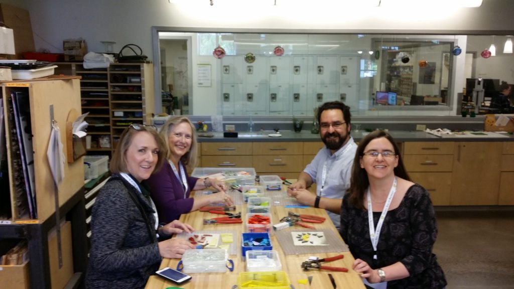 Picture 1 - IALLT members Judi Franz, Stacey Powell, Adan Gallardo, and Shannon Donnally Spasova at the fused glass dish crafting workshop at the crafting center at the University of Oregon.