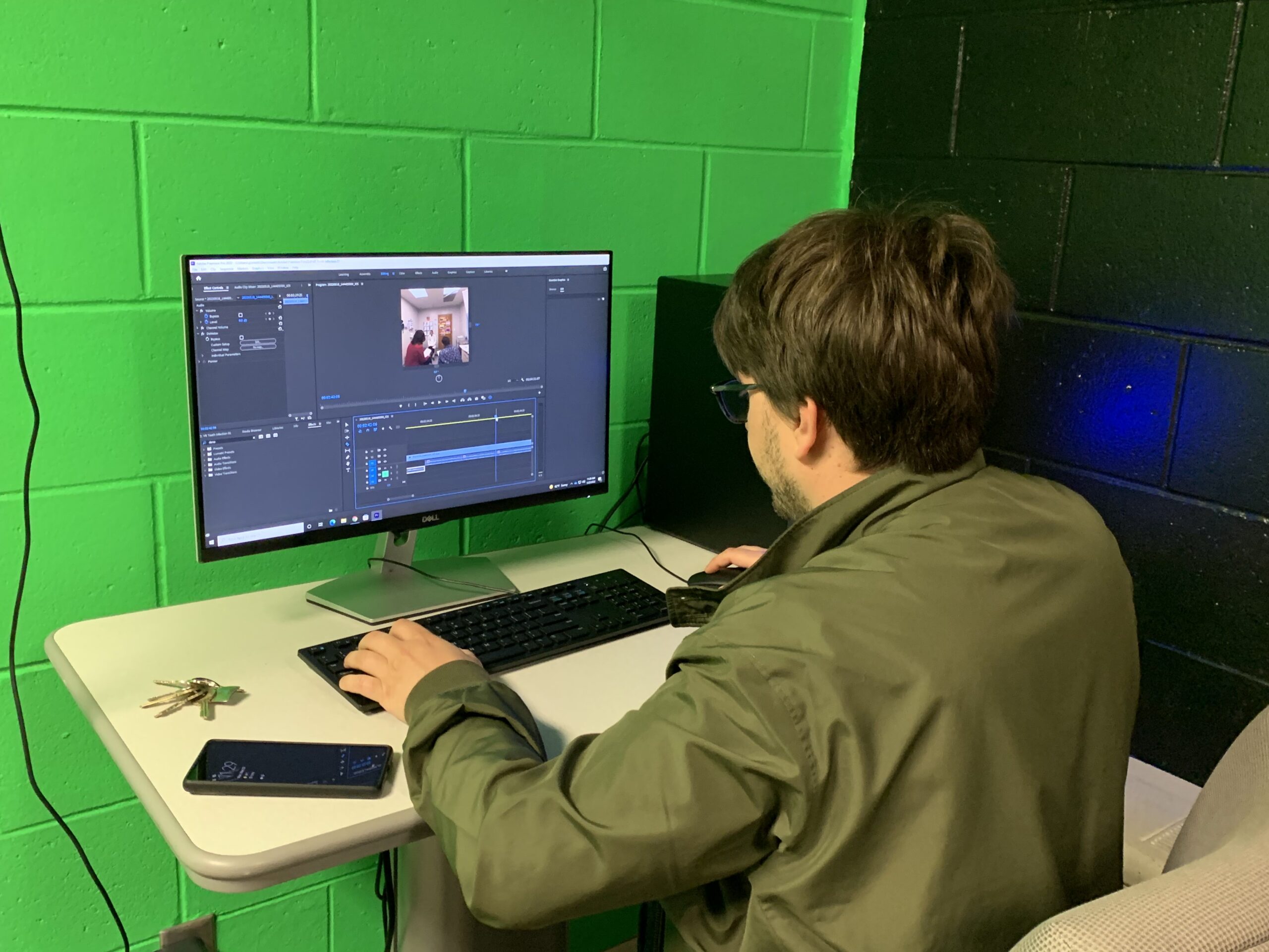 Picture 3 - Editing the VR scenarios in Adobe Premiere Pro - man working at computer
