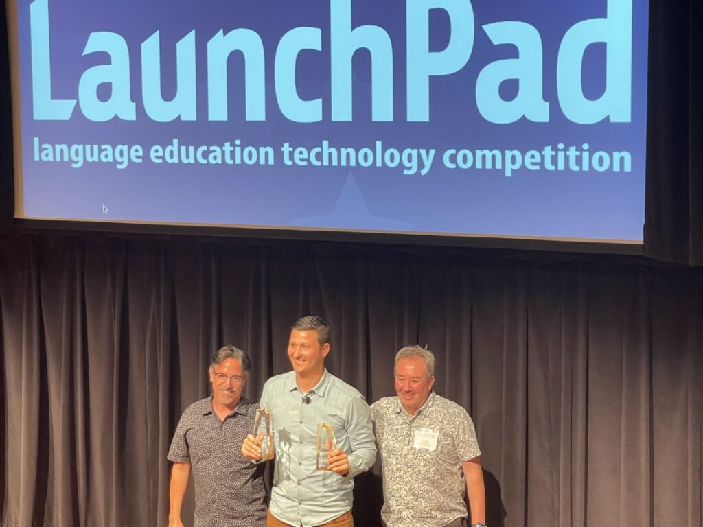 Picture 3 - Lingostar.ai founder Anthony Spadafino accepting his winner’s plaque, screen says LaunchPad: language education technology competition