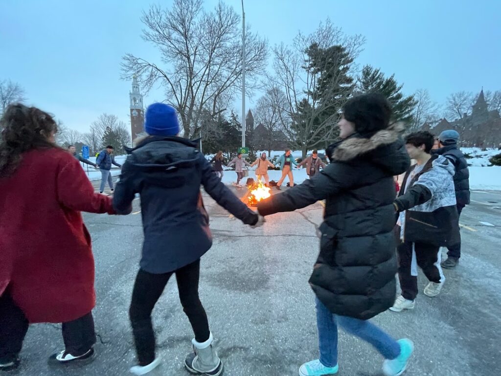 Picture 9 - Burning a Maslenitsa effigy in a parking lot - Students in a circle around a fire