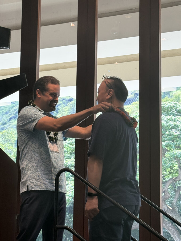 Picture 2 - IALLT President Dan Nickolai greets LET Representative Yuichi Ono; Photo credit: Samanta Buffa