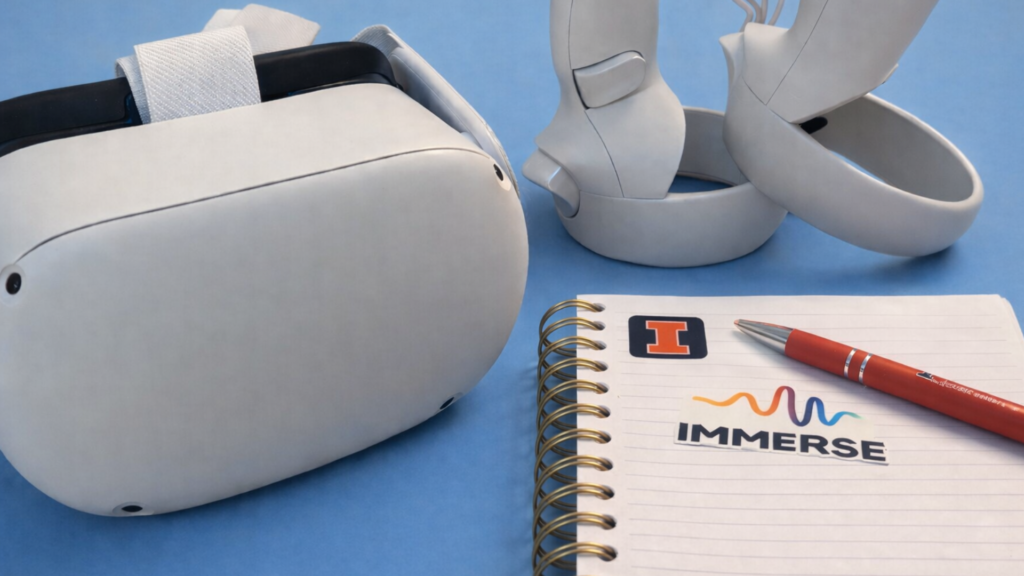 VR headset, controllers, and a notebook that says immerse on it