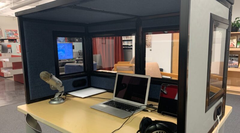 Portable Interpretation Booth Used at Iowa State University - has a microphone, laptop, headphones, and walls to make a booth