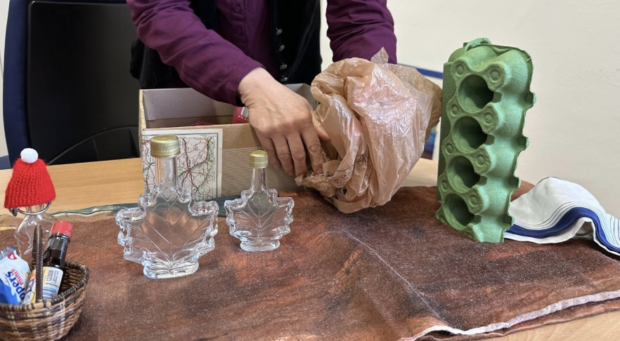 Picture 1 - Demonstration of Objects used for Little Red Riding Hood - there are several glass bottles, a plastic bag, and an egg carton