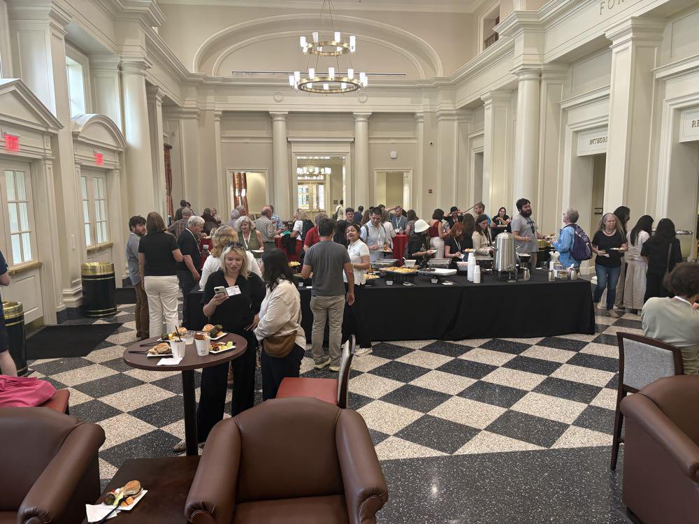 Picture 2 - At a CALICO reception in the Forsythe Commons in the Farmer School of Business at Miami University (photo credit: Lisa Frumkes) - people gathered and having food and coffee