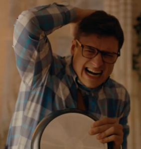 a man wincing in pain
